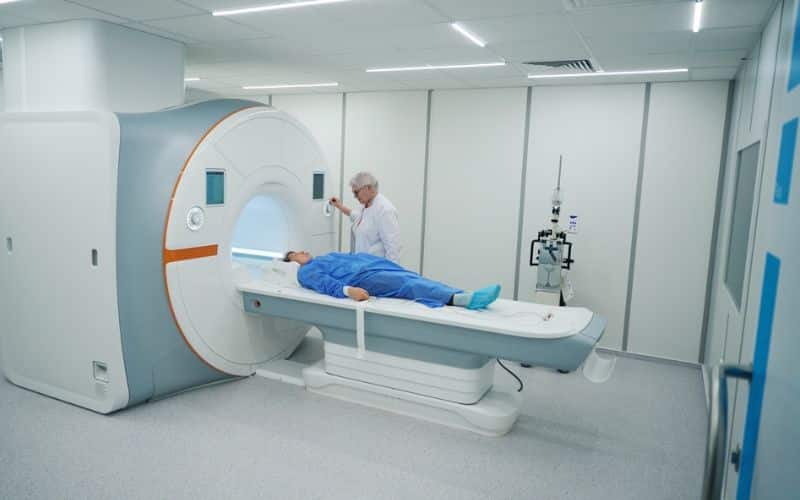 Doctor doing an MRI in the patient 