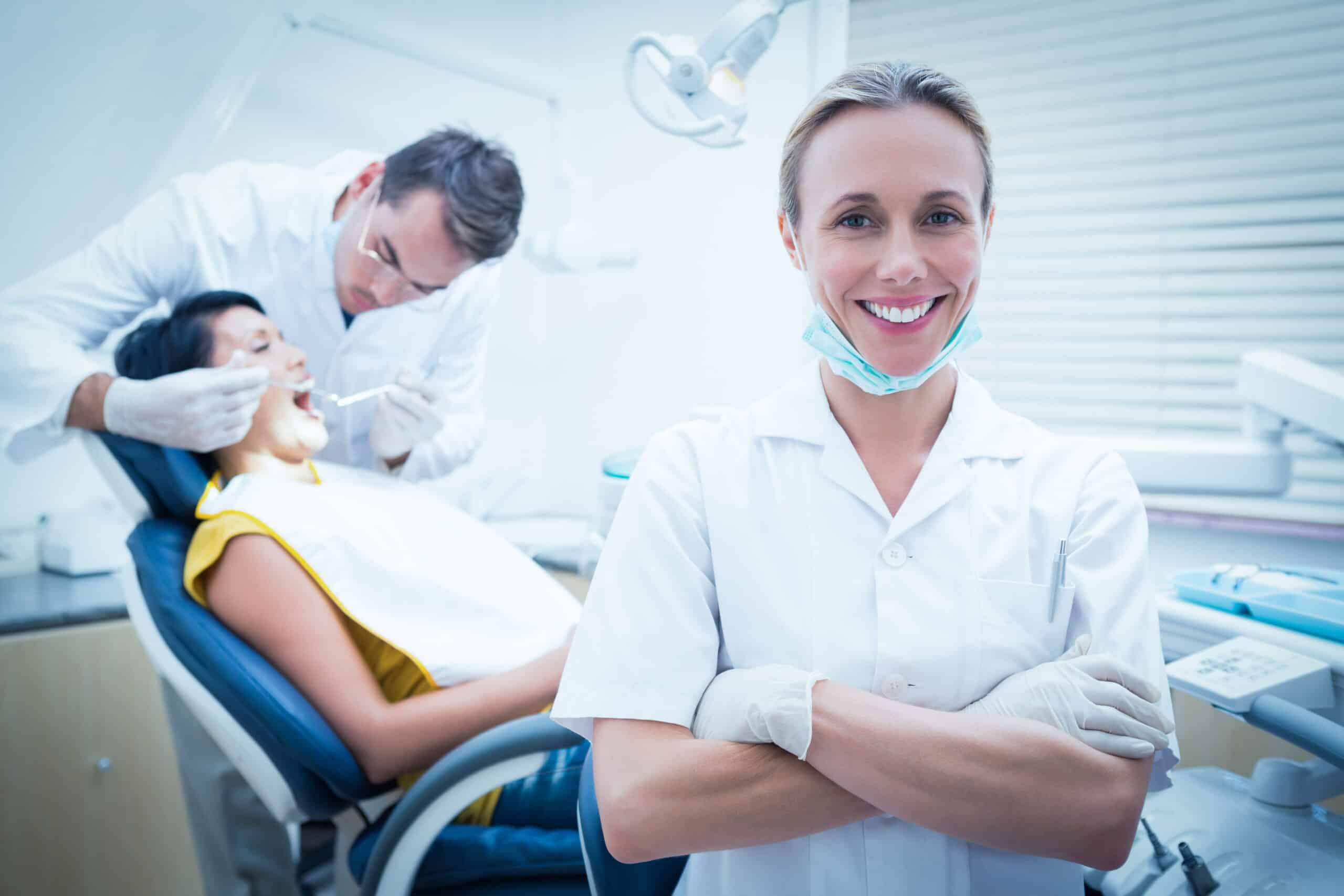 A dental professional in a dental clinic attending to a patient
