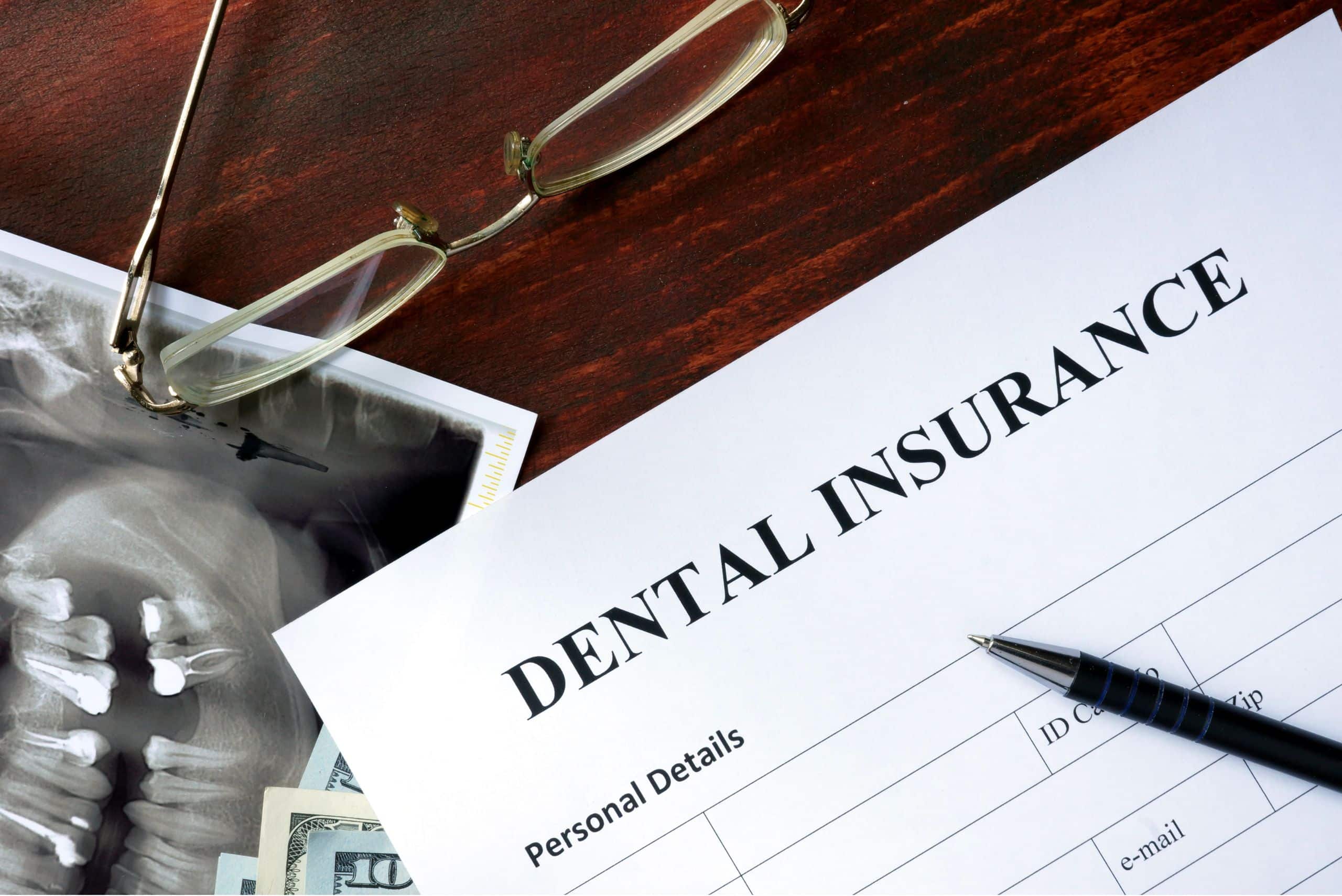 Dental insurance form in wooden table