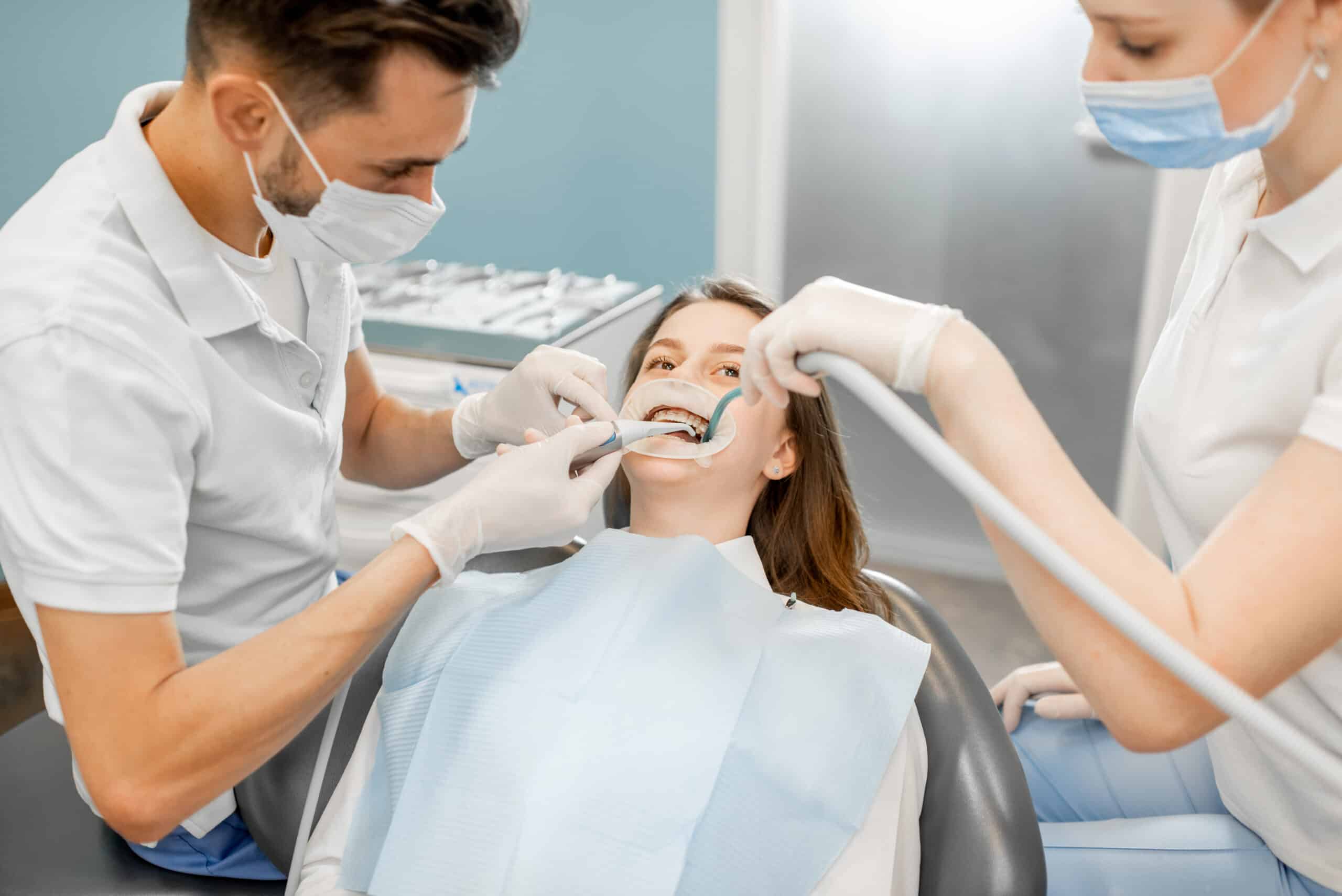  Dentist adjusting orthodontic brackets
