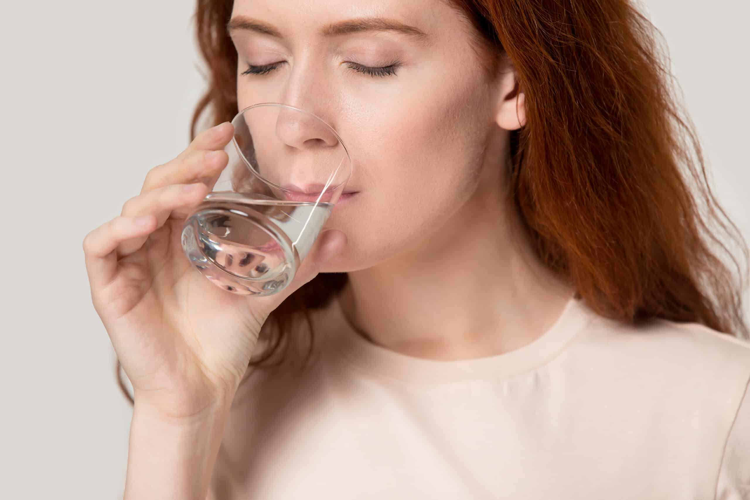 woman drinking plenty of water