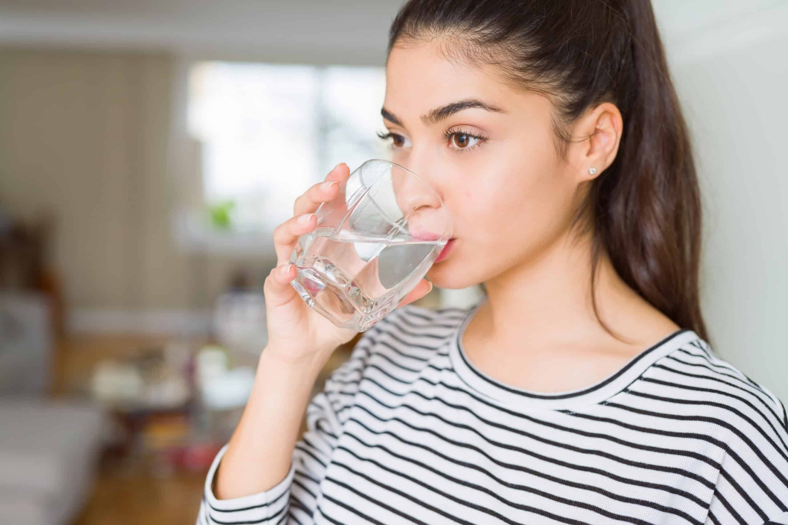 woman drinking a fresh glass of water