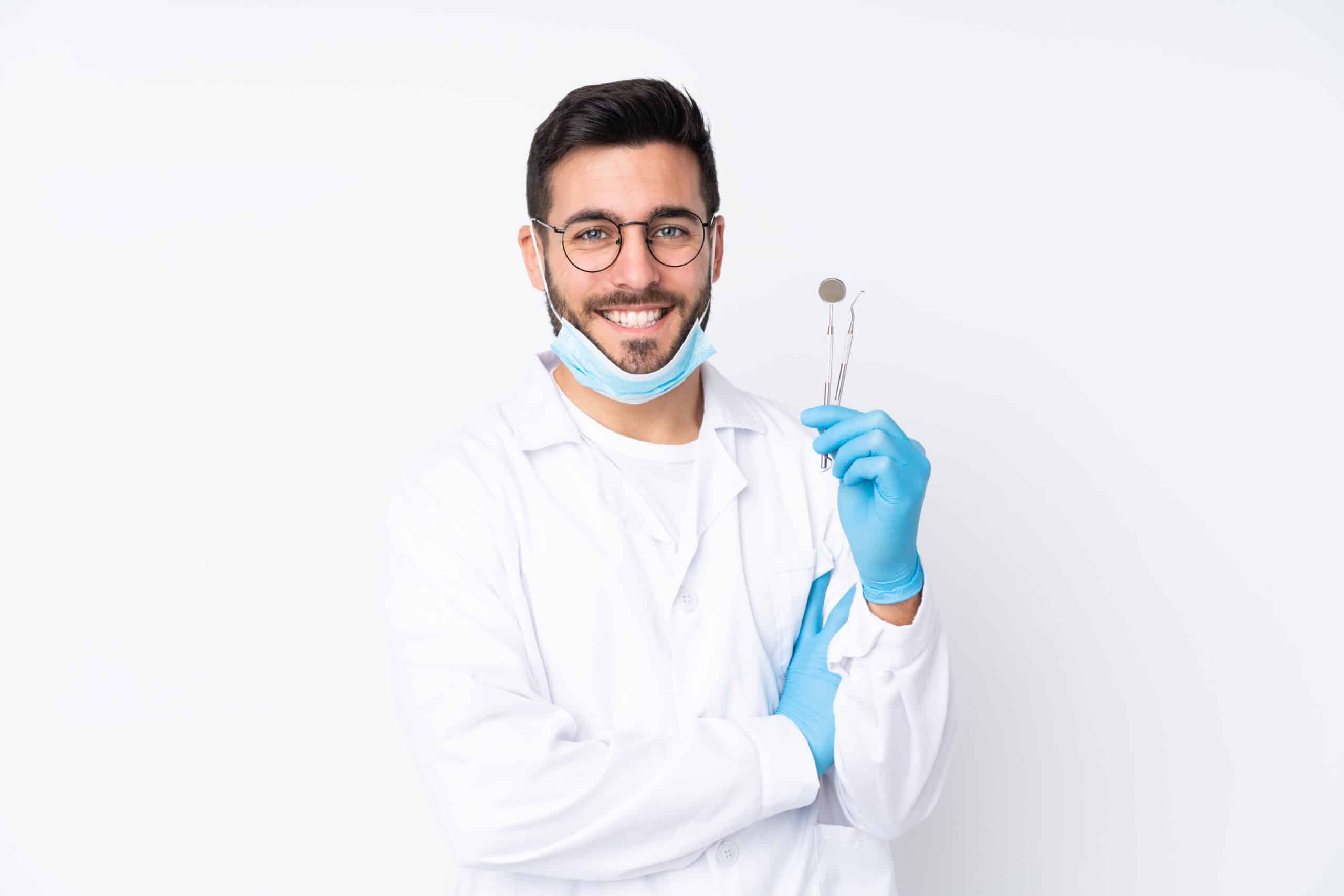 Dentist man holding tools
